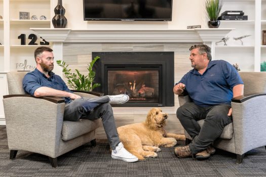 two men and dog sitting in chairs at Gateway Foundation Springfield