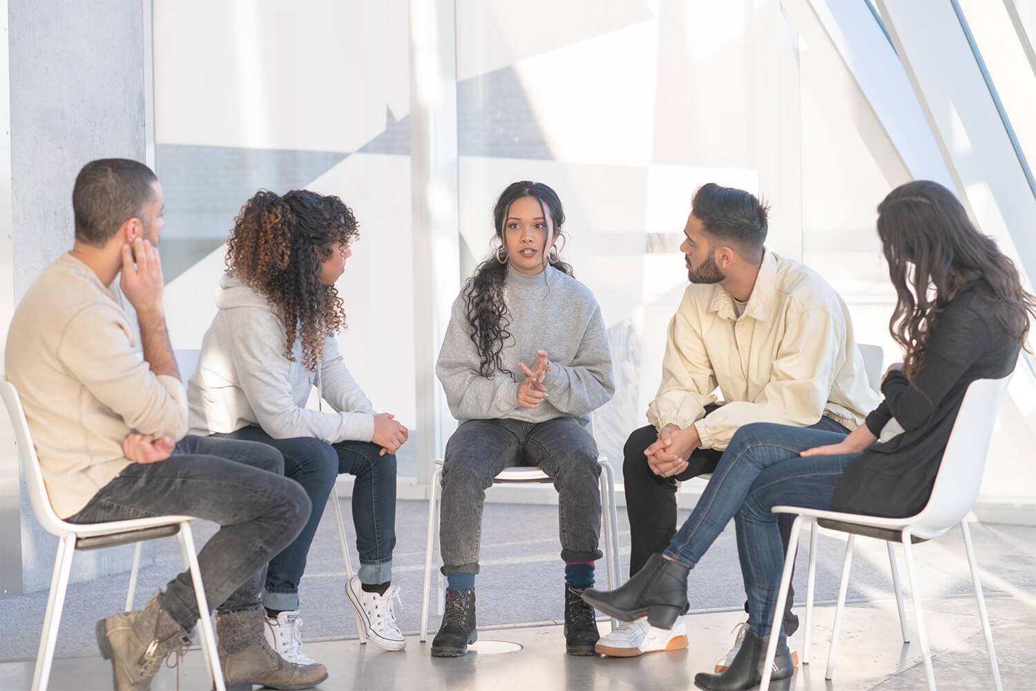 Woman talking in a group therapy session