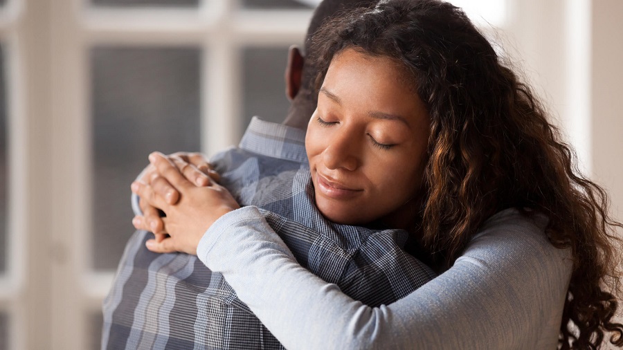 woman and man hugging