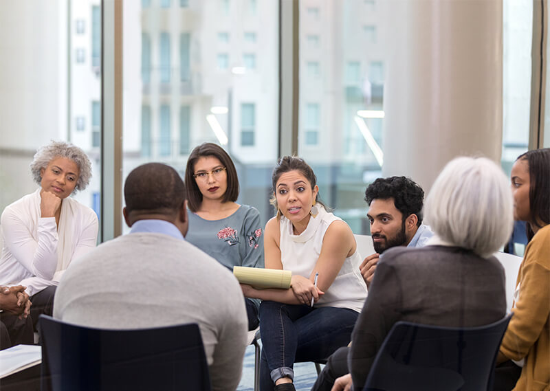 Therapist leading a group therapy session