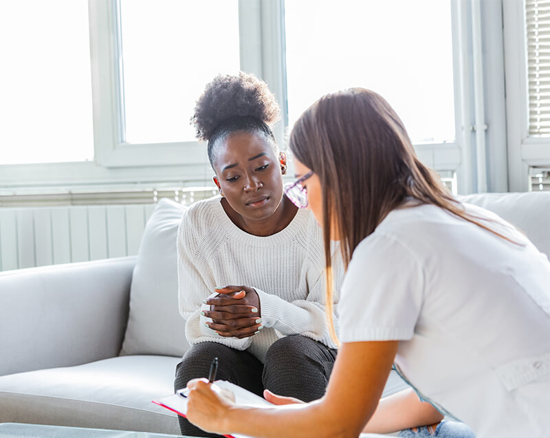 A concerned woman and her therapist