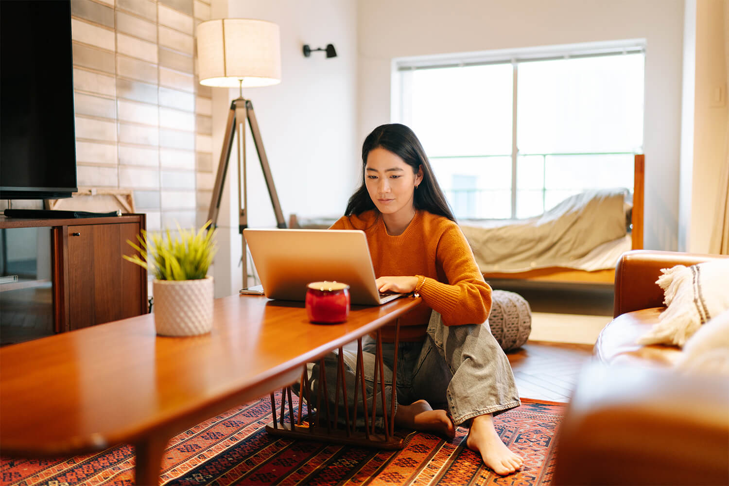 Woman using her laptop at home