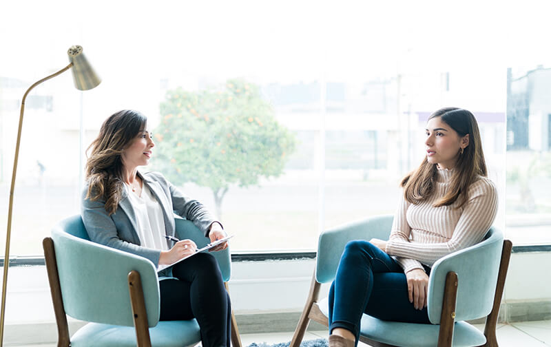 Woman and therapist having a conversation