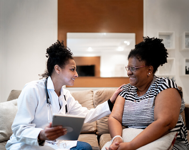 Woman and Doctor going over insurance information