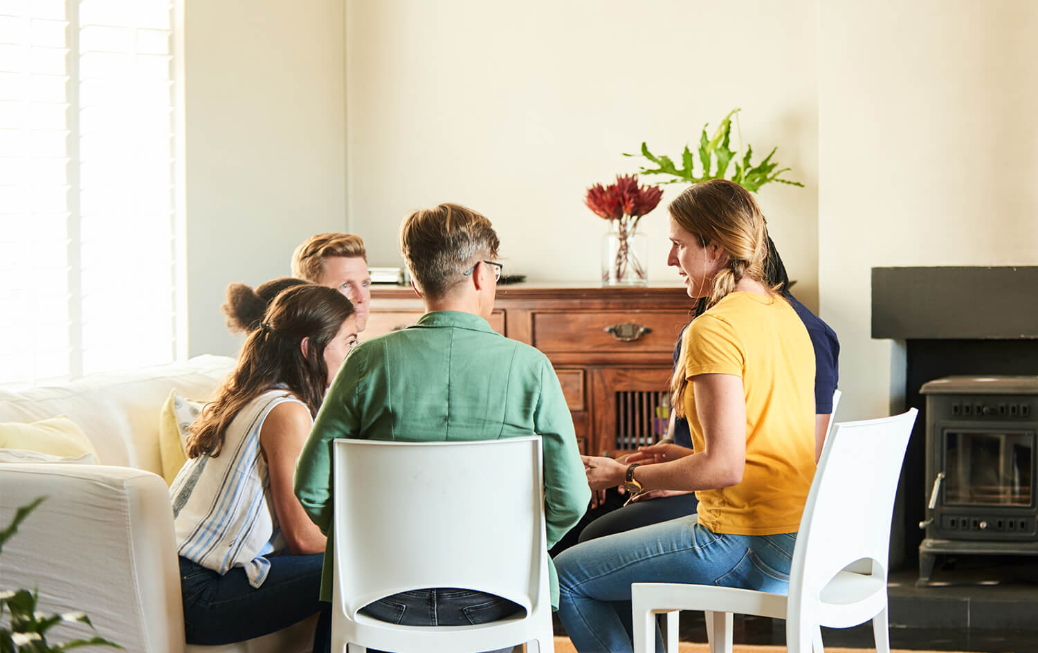 Residents of a recovery home having a group therapy session