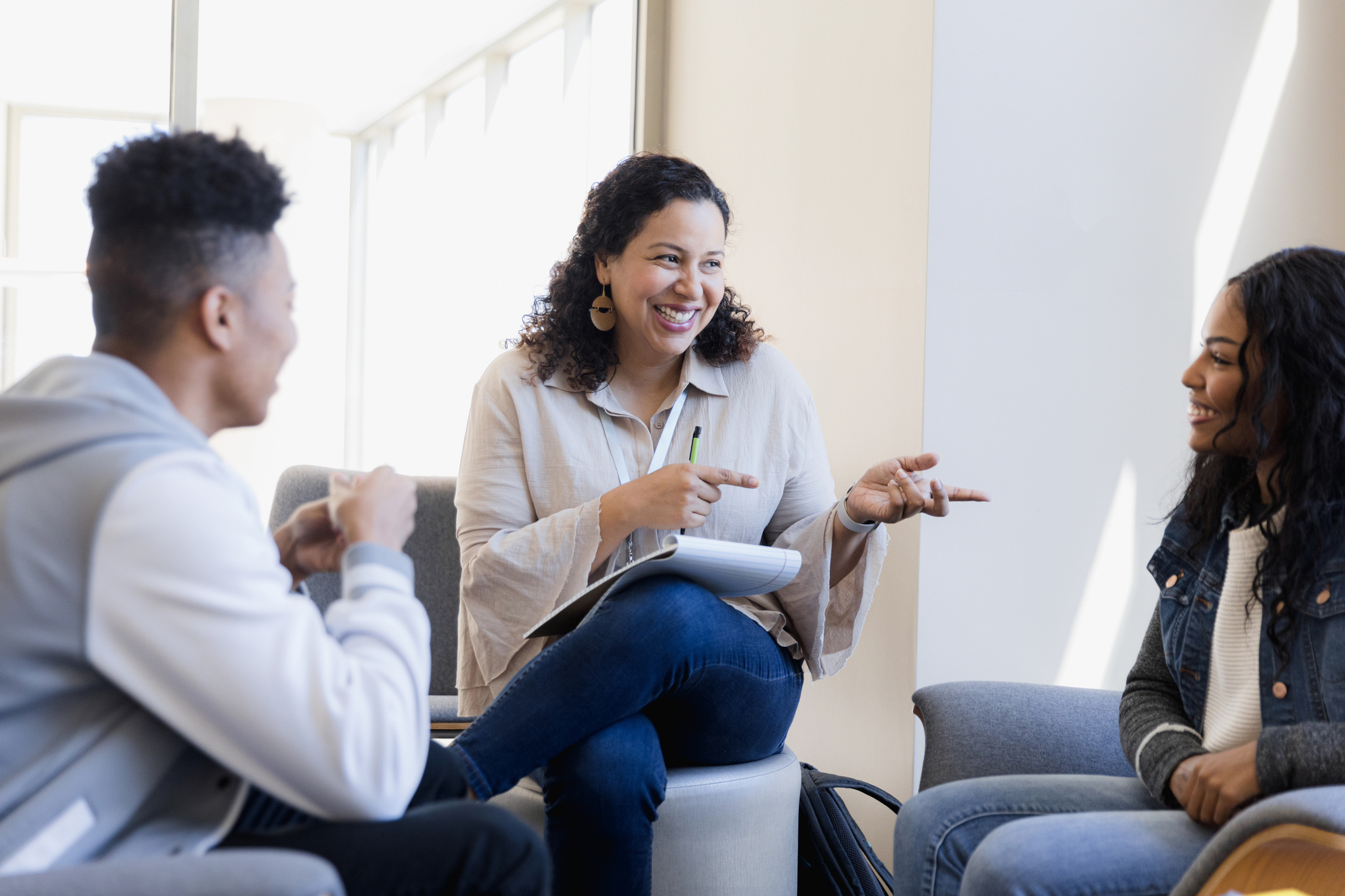 Female guidance counselor has good news for teen students